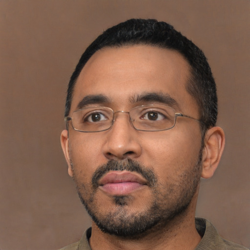 Neutral black adult male with short  black hair and brown eyes