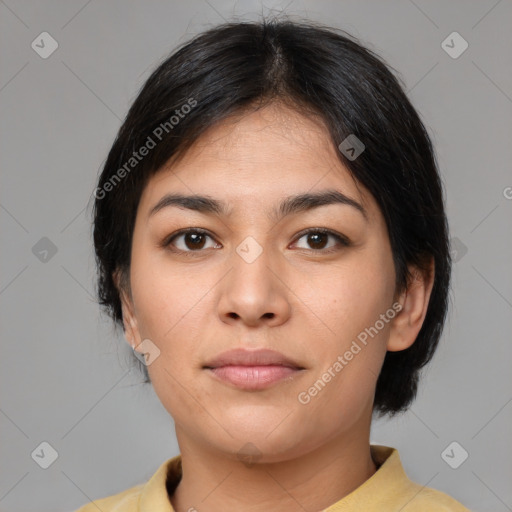 Joyful latino young-adult female with medium  brown hair and brown eyes