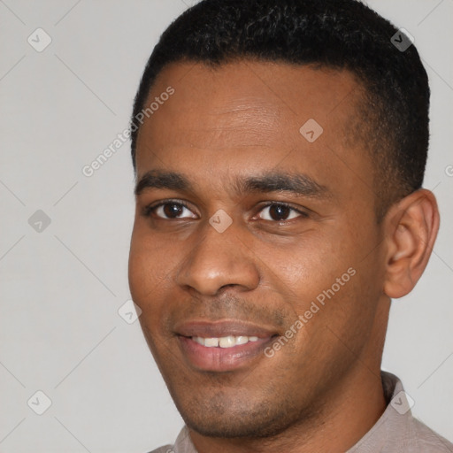 Joyful latino young-adult male with short  brown hair and brown eyes