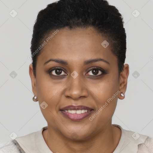 Joyful black young-adult female with short  brown hair and brown eyes