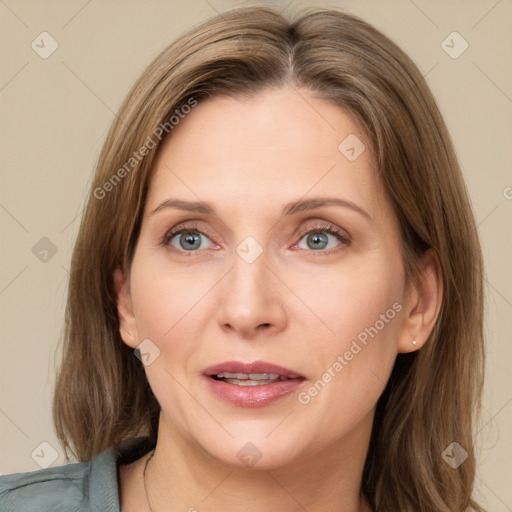 Joyful white adult female with medium  brown hair and green eyes