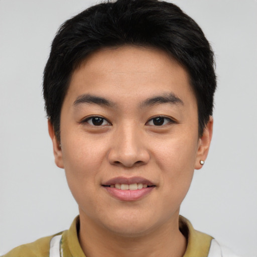 Joyful asian young-adult male with short  brown hair and brown eyes