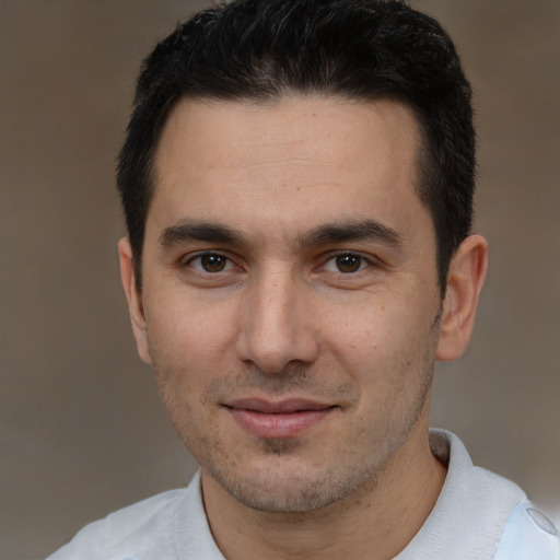 Joyful white young-adult male with short  brown hair and brown eyes