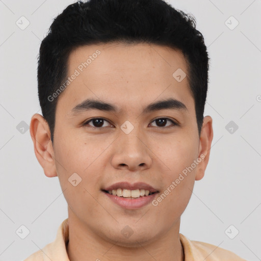 Joyful latino young-adult male with short  brown hair and brown eyes