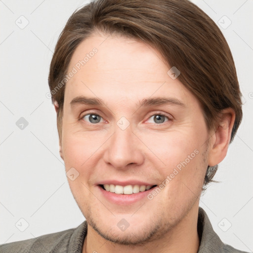 Joyful white young-adult female with short  brown hair and grey eyes