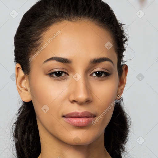 Joyful latino young-adult female with long  brown hair and brown eyes