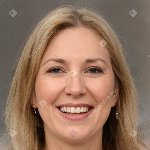 Joyful white adult female with long  brown hair and brown eyes