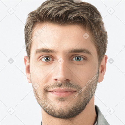 Joyful white young-adult male with short  brown hair and grey eyes