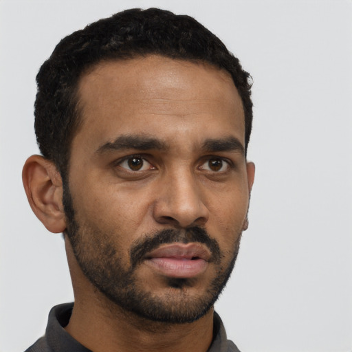 Neutral black young-adult male with short  black hair and brown eyes