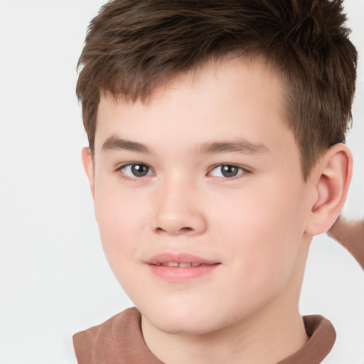 Joyful white child male with short  brown hair and brown eyes