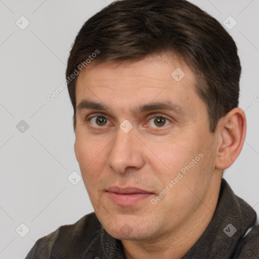 Joyful white adult male with short  brown hair and brown eyes