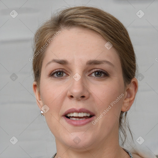 Joyful white adult female with medium  brown hair and grey eyes