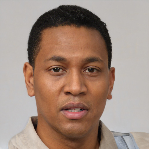 Neutral latino young-adult male with short  brown hair and brown eyes