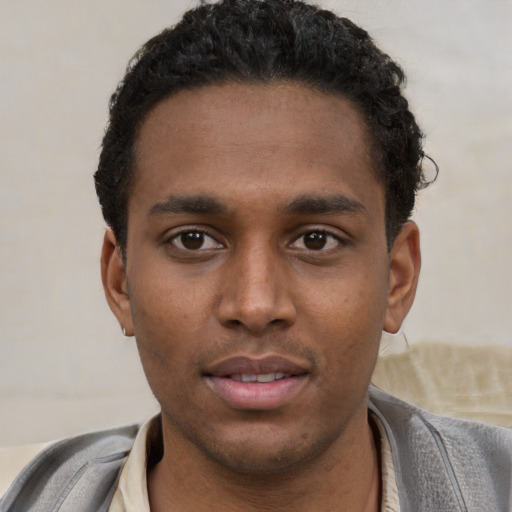 Neutral latino young-adult male with short  brown hair and brown eyes