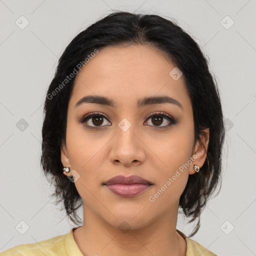 Joyful latino young-adult female with medium  brown hair and brown eyes