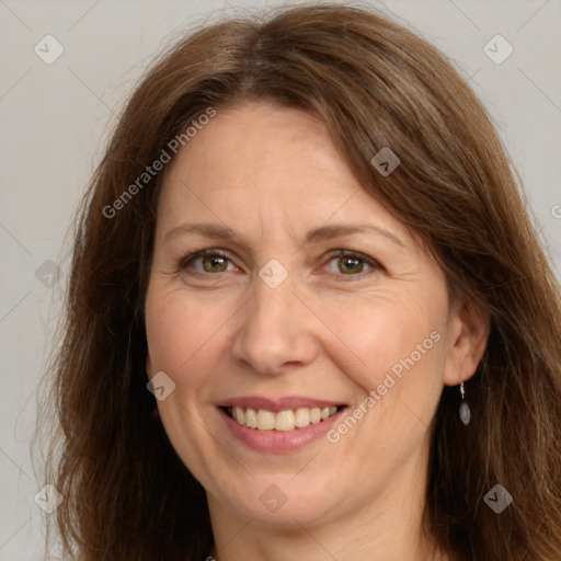 Joyful white adult female with long  brown hair and brown eyes