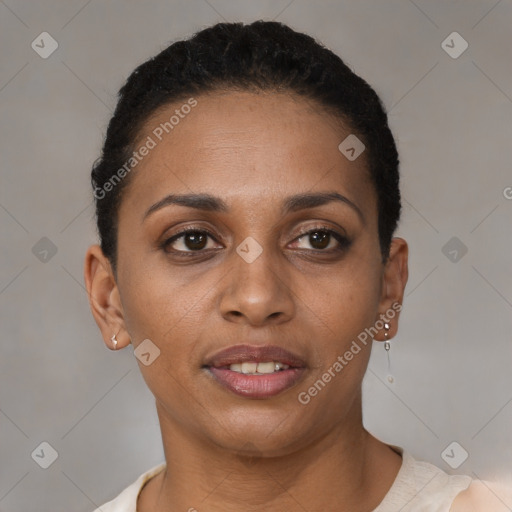 Joyful black young-adult female with short  brown hair and brown eyes