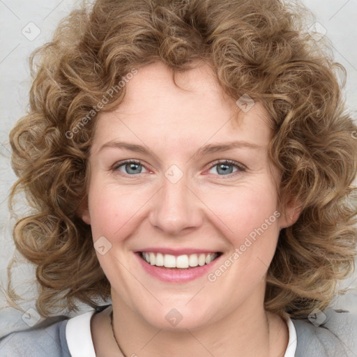 Joyful white young-adult female with medium  brown hair and blue eyes