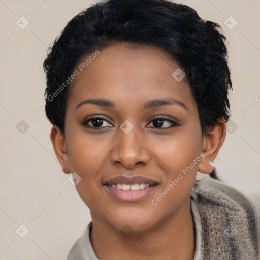 Joyful black young-adult female with short  black hair and brown eyes