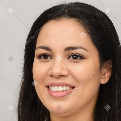 Joyful asian young-adult female with long  brown hair and brown eyes