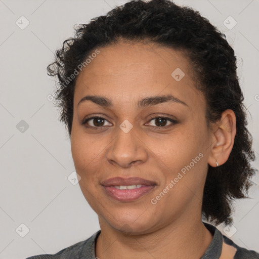 Joyful latino young-adult female with short  brown hair and brown eyes