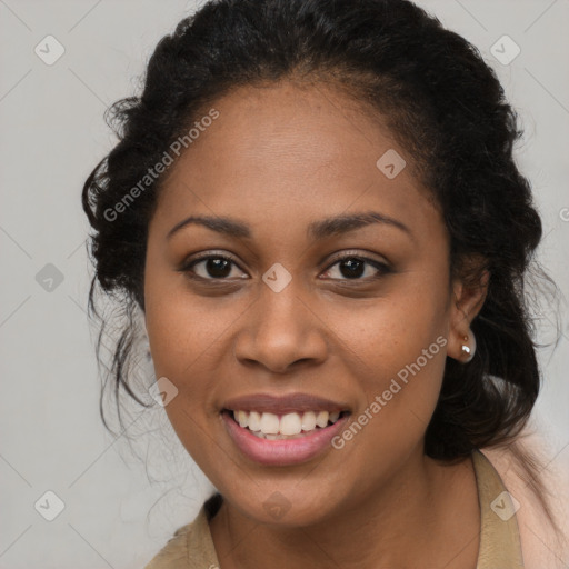 Joyful black young-adult female with long  brown hair and brown eyes