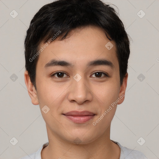 Joyful asian young-adult male with short  brown hair and brown eyes