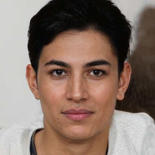 Joyful white young-adult male with short  black hair and brown eyes