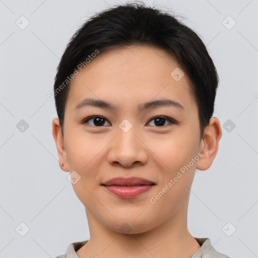 Joyful asian young-adult female with short  brown hair and brown eyes