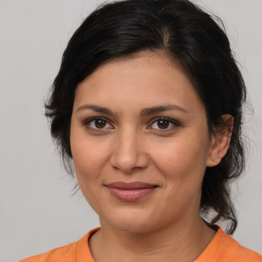 Joyful white young-adult female with medium  brown hair and brown eyes