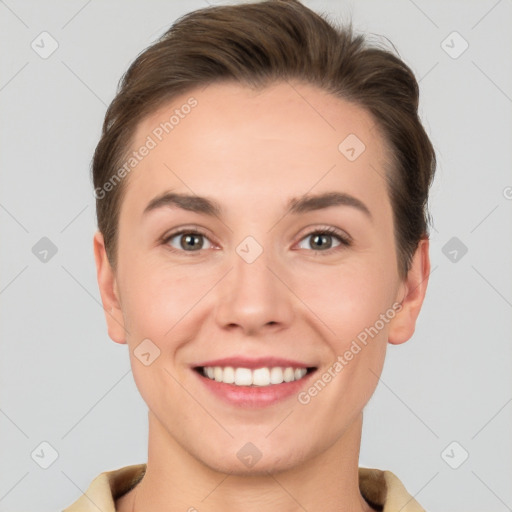 Joyful white young-adult female with short  brown hair and grey eyes