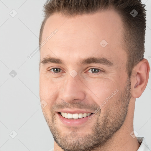 Joyful white young-adult male with short  brown hair and brown eyes