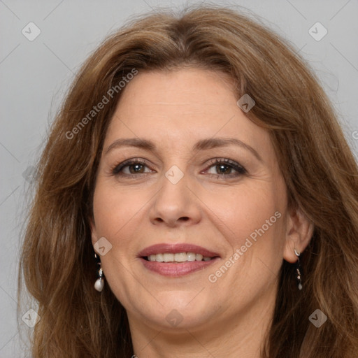 Joyful white adult female with long  brown hair and brown eyes