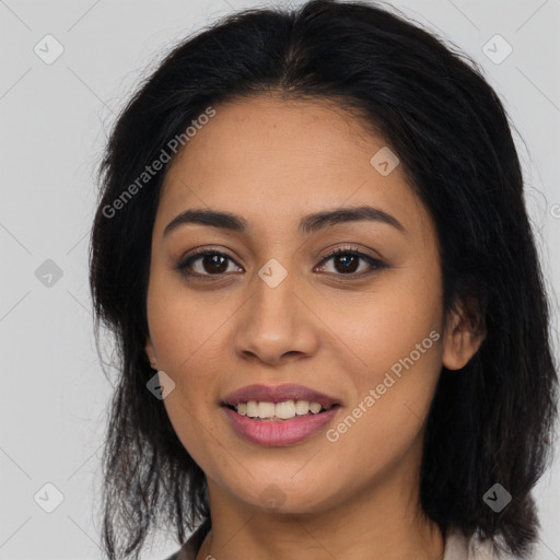 Joyful latino young-adult female with long  brown hair and brown eyes