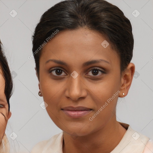 Joyful latino young-adult female with medium  brown hair and brown eyes