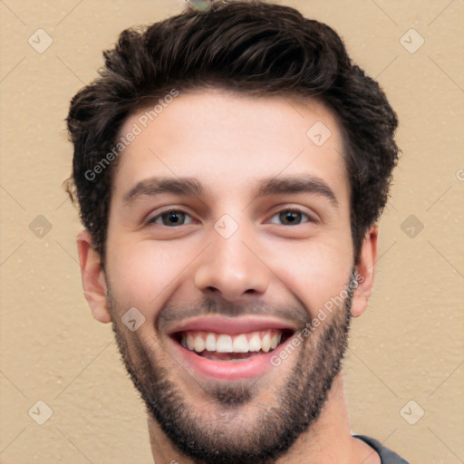 Joyful white young-adult male with short  black hair and brown eyes