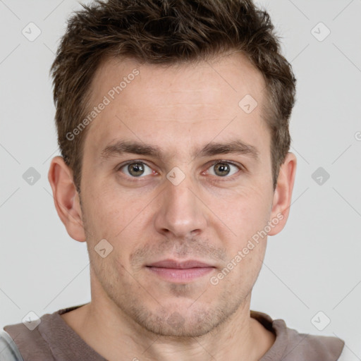 Joyful white adult male with short  brown hair and grey eyes