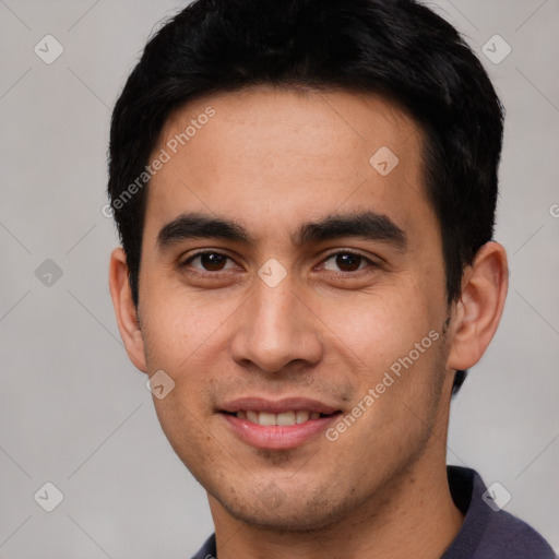 Joyful white young-adult male with short  black hair and brown eyes