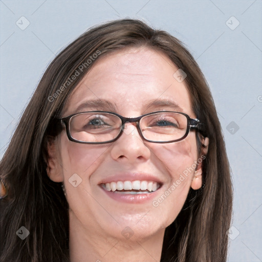 Joyful white adult female with long  brown hair and grey eyes