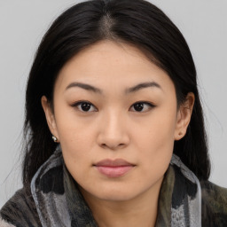 Joyful asian young-adult female with medium  black hair and brown eyes