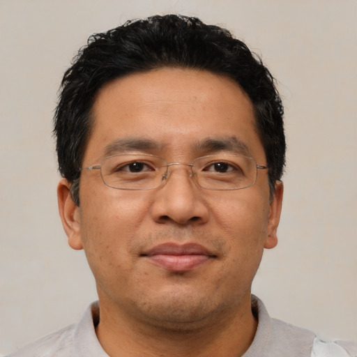 Neutral asian adult male with short  black hair and brown eyes