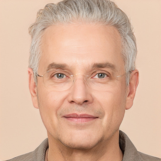 Joyful white middle-aged male with short  gray hair and brown eyes