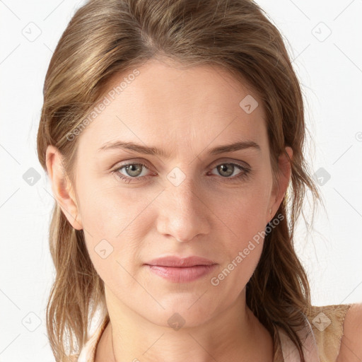 Joyful white young-adult female with long  brown hair and blue eyes