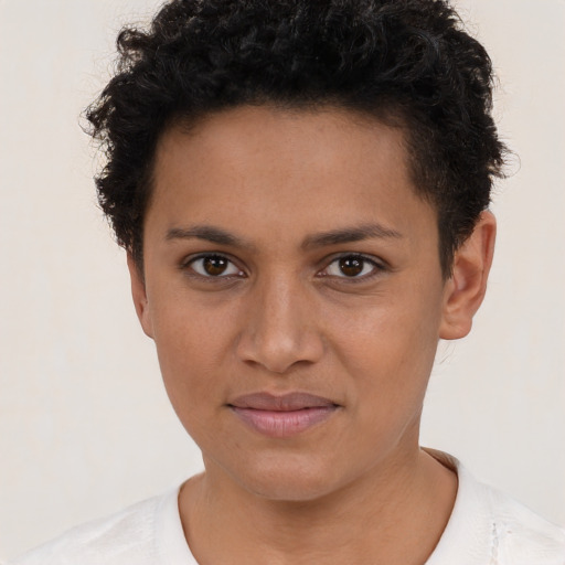Joyful latino young-adult female with short  brown hair and brown eyes