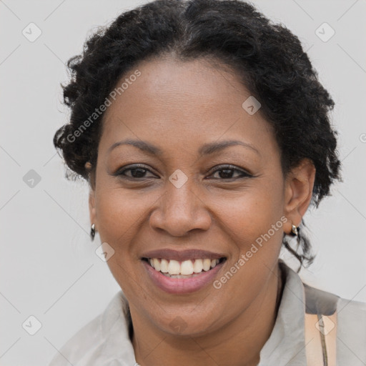 Joyful black adult female with short  brown hair and brown eyes