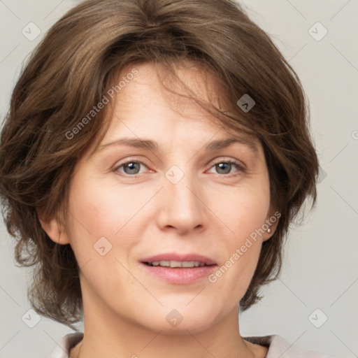 Joyful white adult female with medium  brown hair and grey eyes