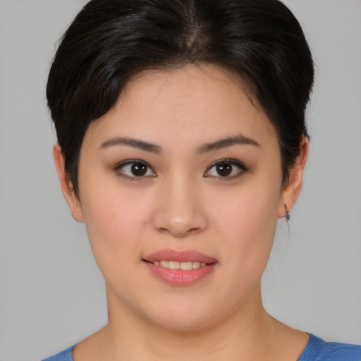 Joyful white young-adult female with medium  brown hair and brown eyes