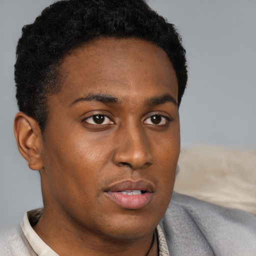 Neutral black young-adult male with short  brown hair and brown eyes