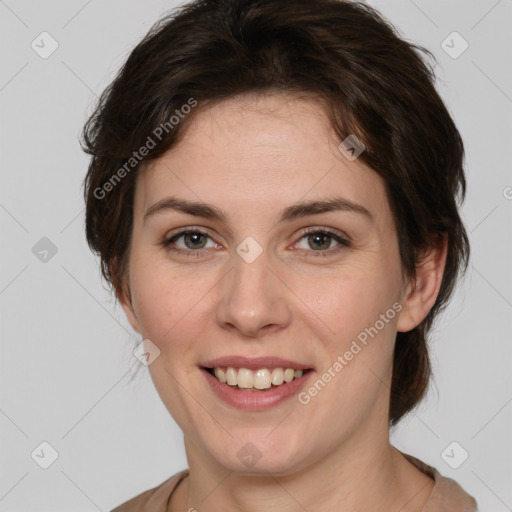 Joyful white young-adult female with medium  brown hair and green eyes