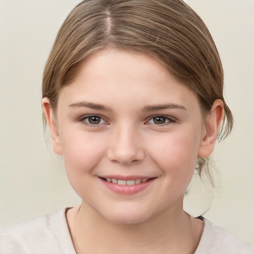 Joyful white child female with medium  brown hair and brown eyes